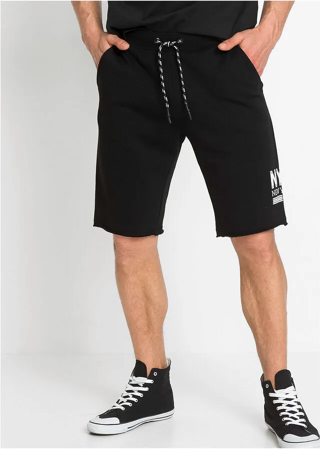 Black regular fit open hem sweat shorts with print