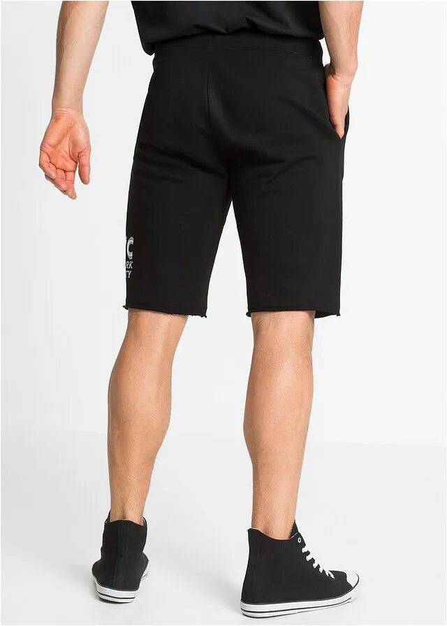 Black regular fit open hem sweat shorts with print