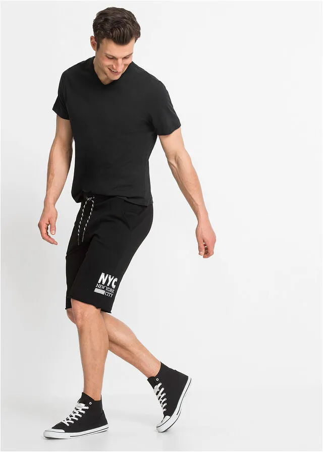 Black regular fit open hem sweat shorts with print