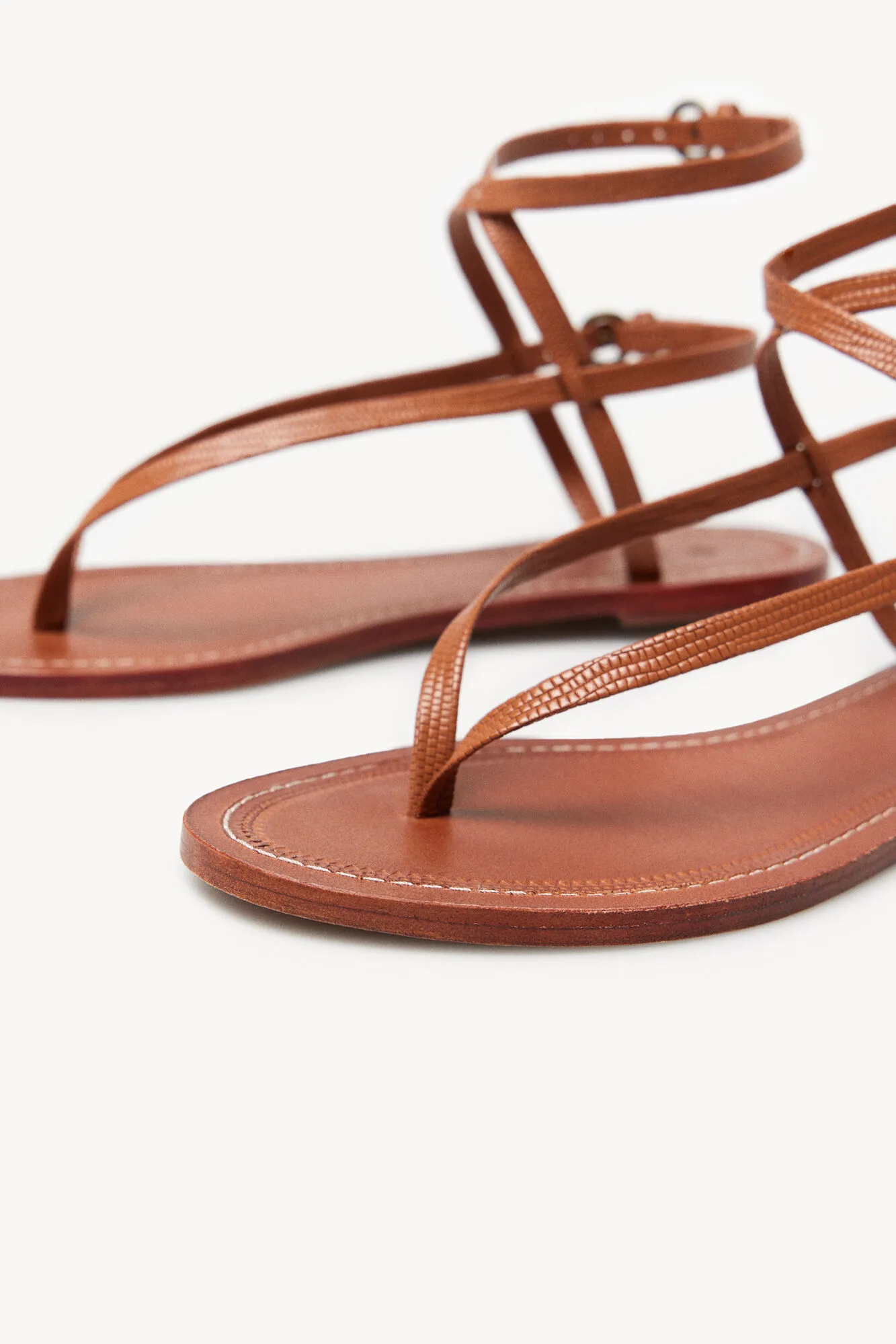 Maisa Flat Leather Sandals with Embossed Design.