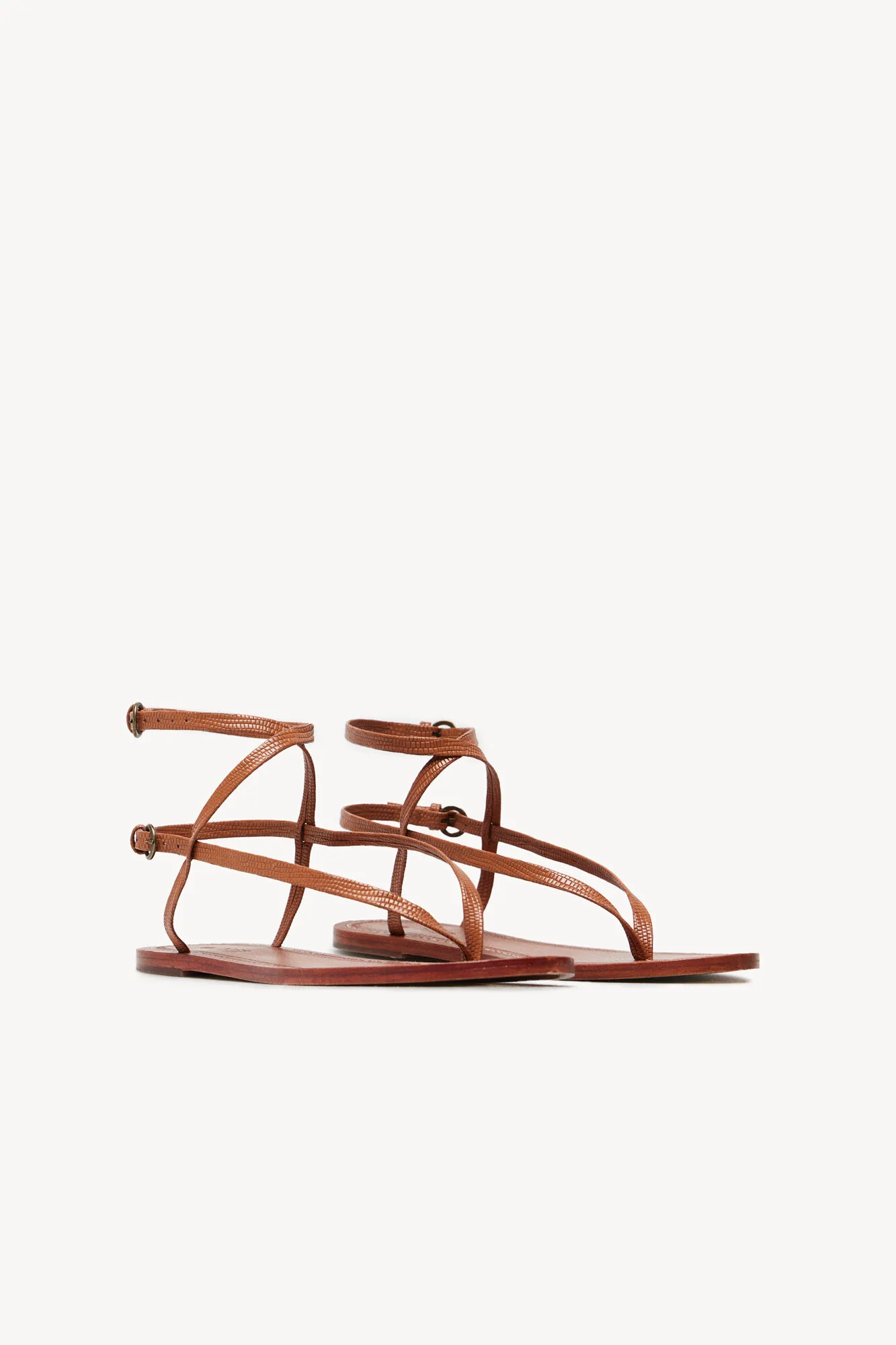 Maisa Flat Leather Sandals with Embossed Design.