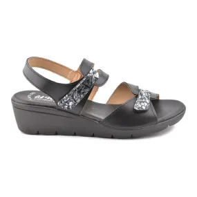 Black leather wedge sandals by Amelie.