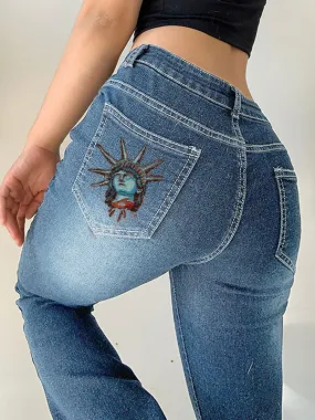 Low-rise bell bottom jeans with Statue of Liberty print.