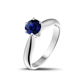 White gold solitaire ring with round sapphire.